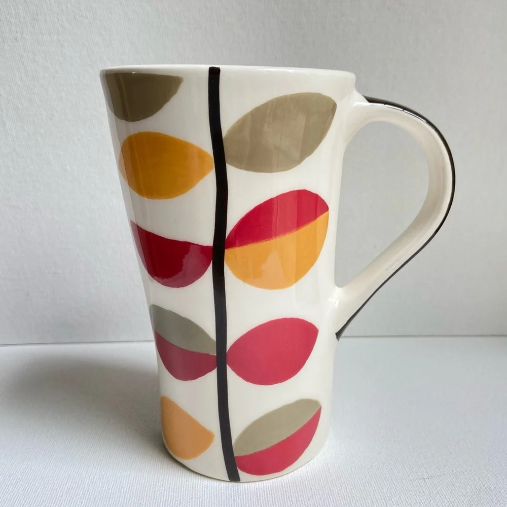 Pier 1 tall asymmetrical oval coffee mug with abstract fall leaves and stripes